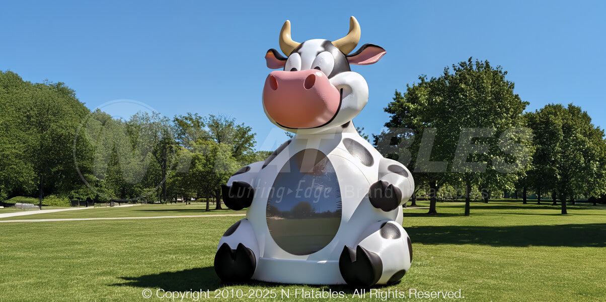 24-foot Commercial Inflatable Cow Bouncer™ on grass surface
