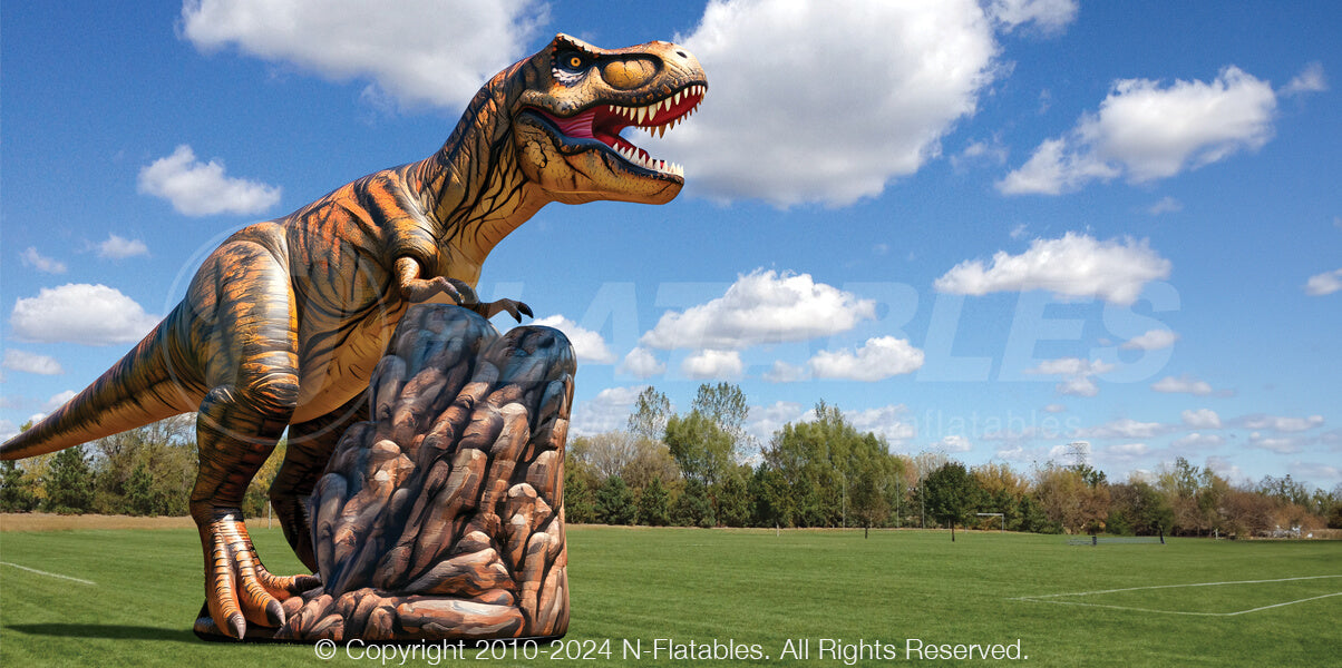 Inflatable T-Rex on Rock Display