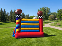 Side View Shot of All Sport Inflatable Bounce House setup on grass surface