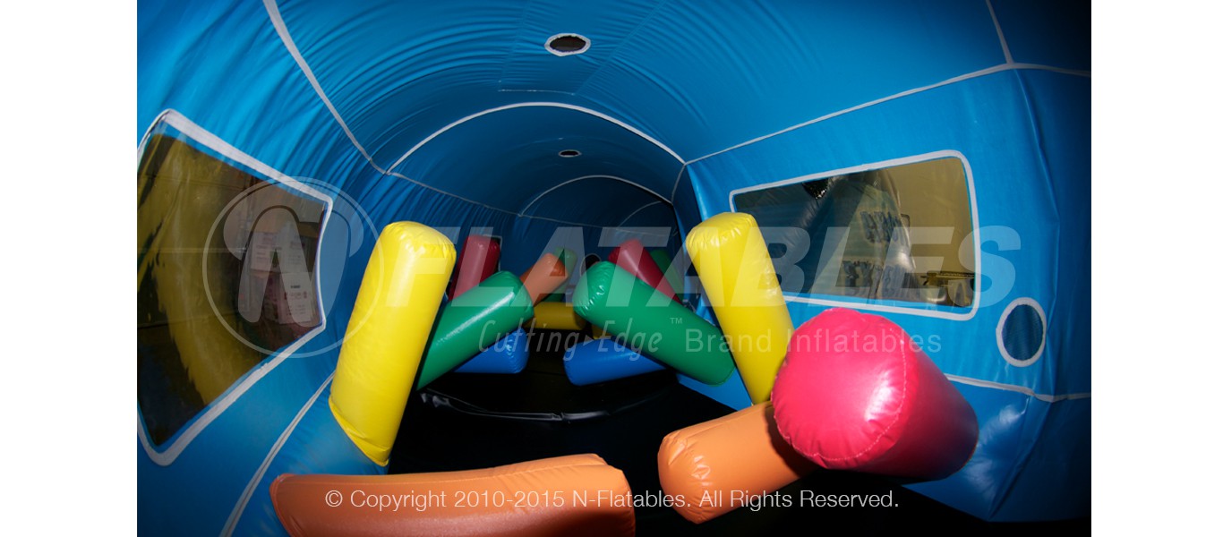 Tackle dummy obstacles inside the Arctic Expedition inflatable tunnel slide. 