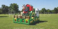 Barnyard Breakout dual obstacle course with slides, inflatable tractor, barn, silo, and farm animals. 