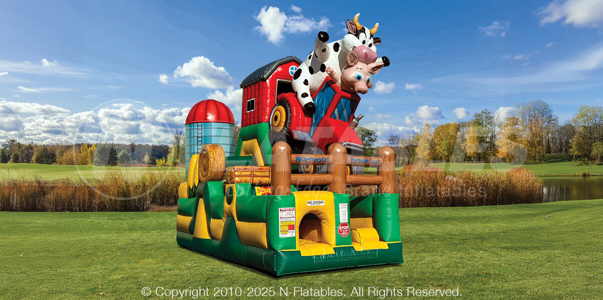 Barnyard Breakout single 180 obstacle with inflatable cow, pig, tractor, silo, and corn elements. 