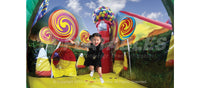 Girl bouncing inside the Candy Fun Center inflatable playground