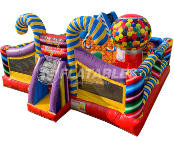 Candy Playland™ commercial inflatable with bouncer and slide on white background. 