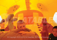 Inside view of the Dragon Hide-n-Slide™ inflatable combo with kids playing