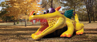 Quarter view of the Dragon Hide-n-Slide™ inflatable combo set up in an outdoor park