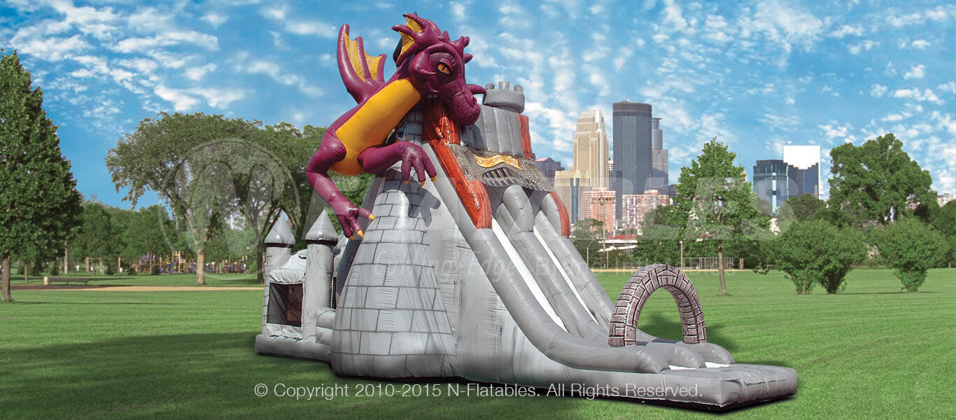 Dragon’s Tower Slide Combo™ commercial grade inflatable bounce house in a park 