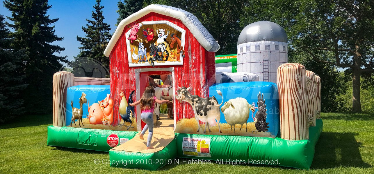 Farm Yard™ Playland featuring a colorful red barn entrance filled with farm animal graphics. 