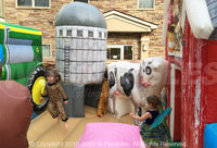 Inside of the Farm Yard™ Playland featuring toddler bouncing area and inflatable pop ups. 
