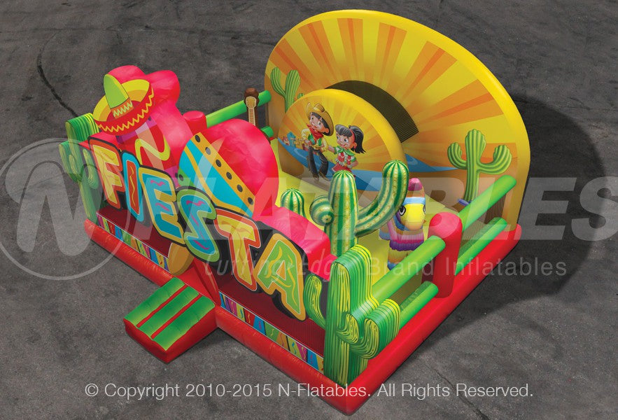 An aerial view of the Fiesta Playland™ commercial-grade inflatable playground featuring a bouncing area, slide, and pop-ups of cacti, a piñata, and a guitar. 