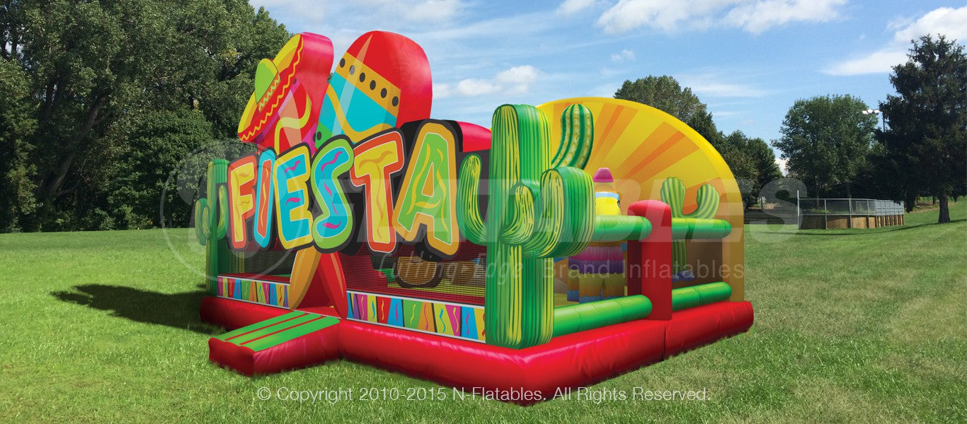 A 3/4 view of the Fiesta Playland™ commercial grade inflatable playground showing the colorful fiesta themed entrance, the mesh visibility panels, and the large sunset backdrop. 