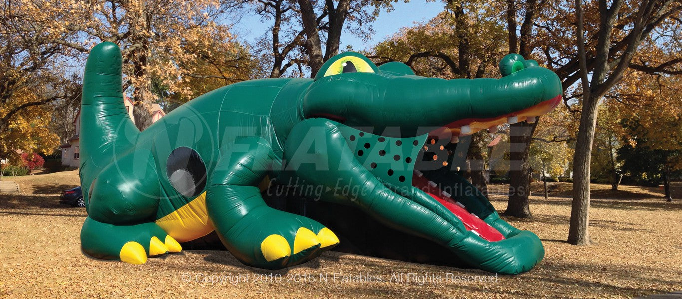 Gator Hide-n-Slide™ Kid Combo commercial inflatable set up at an outdoor park. 