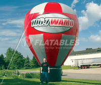 Large red and silver hot air balloon shaped inflatable with branding. 