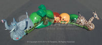 Aerial view of the Jungle Crawl inflatable tunnel with elephant, trees, lion, and giraffe design elements. 