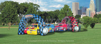 Kiddy Grand Prix inflatable car racing themed tunnel crawl through in a park. 