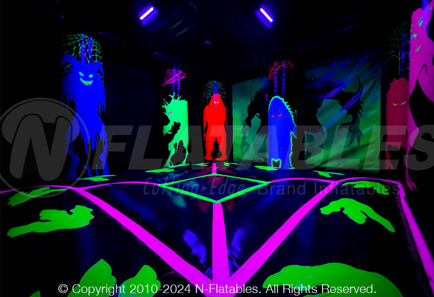 Inside corner view of monster box blacklight bounce house junior