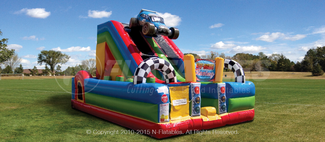Off-Road Slide Combo™ commercial grade racecar themed playground with checkered race flags and an inflatable race car