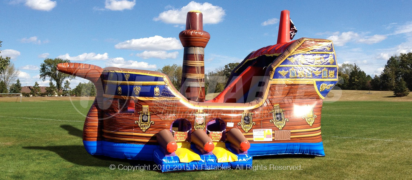 Side view of the Pirate Ship™ inflatable combo set up outdoors. 