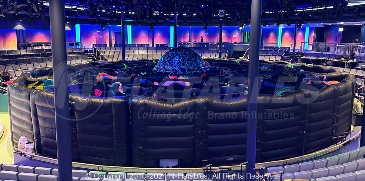 View of the outside of a custom modular laser tag maze that is blacklight reactive. 