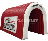 Red and white inflatable tunnel for sports team with custom branding
