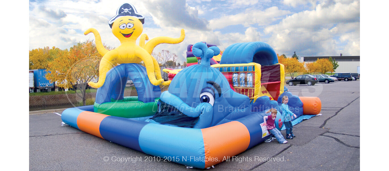 Corner view of the Sea Park inflatable play area for toddlers with a happy smiling inflatable octopus and whale