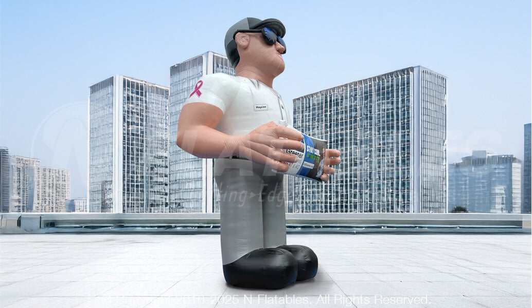 Side view of a custom advertising inflatable service technician standing on top of a building. 