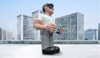 Side view of a custom advertising inflatable service technician standing on top of a building. 