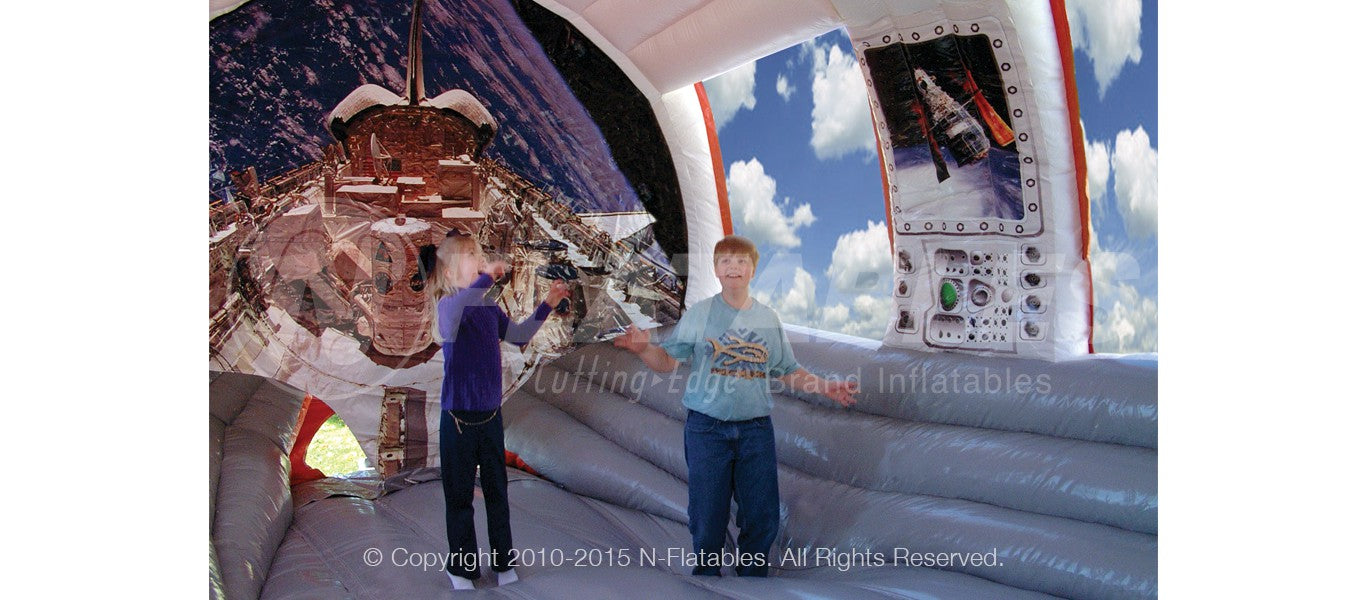 Kids jumping inside the Shuttle Play Space™ bounce house. 