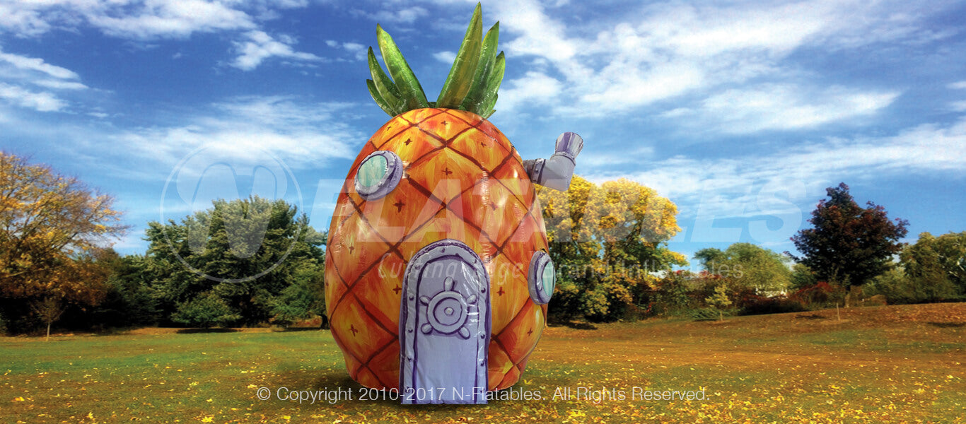 29' inflatable replica of spongebob's pineapple house set up in a park.  