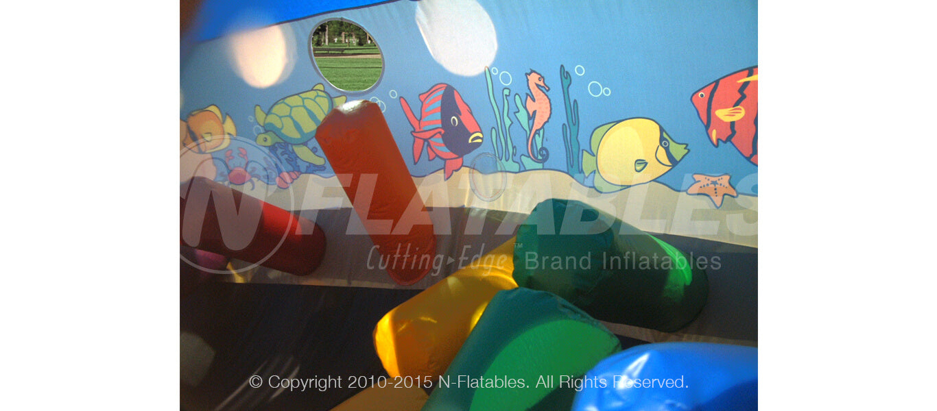 Tackle dummies inside of the Under the Sea inflatable crawl through. 