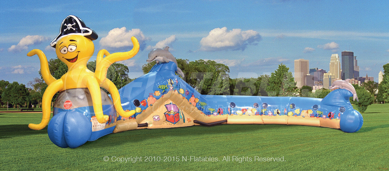 Under the Sea aquarium themed inflatable crawl through for kids in a park setting. 