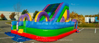 A quarter view of the Wacky Slide Combo™ featuring inflatable slide and obstacles